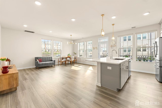 4 Arnold Dr Unit 5302, Wood-Ridge, NJ 07075 - kitchen with light countertops, gray cabinets, wood finished floors, open floor plan, and recessed lighting