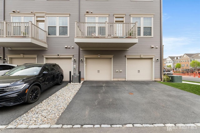 4 Arnold Dr Unit 5302, Wood-Ridge, NJ 07075 - view of front of home featuring an attached garage, driveway, and a balcony