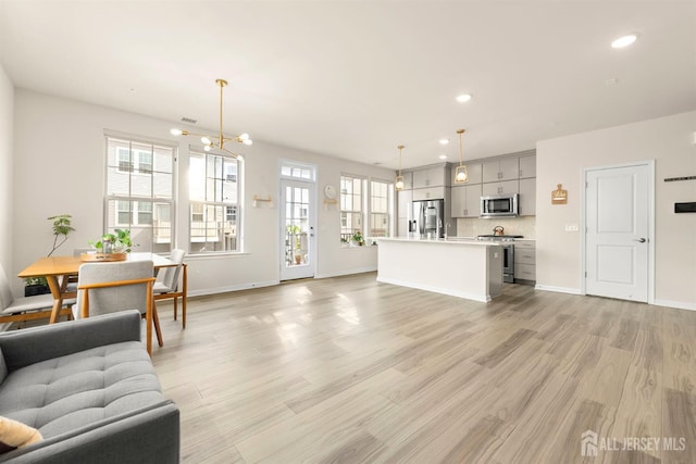 4 Arnold Dr Unit 5302, Wood-Ridge, NJ 07075 - living area featuring light wood-type flooring, recessed lighting, and a chandelier