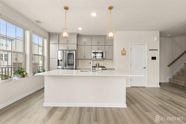 4 Arnold Dr Unit 5302, Wood-Ridge, NJ 07075 - kitchen with stainless steel appliances, gray cabinets, light wood-type flooring, light countertops, and recessed lighting