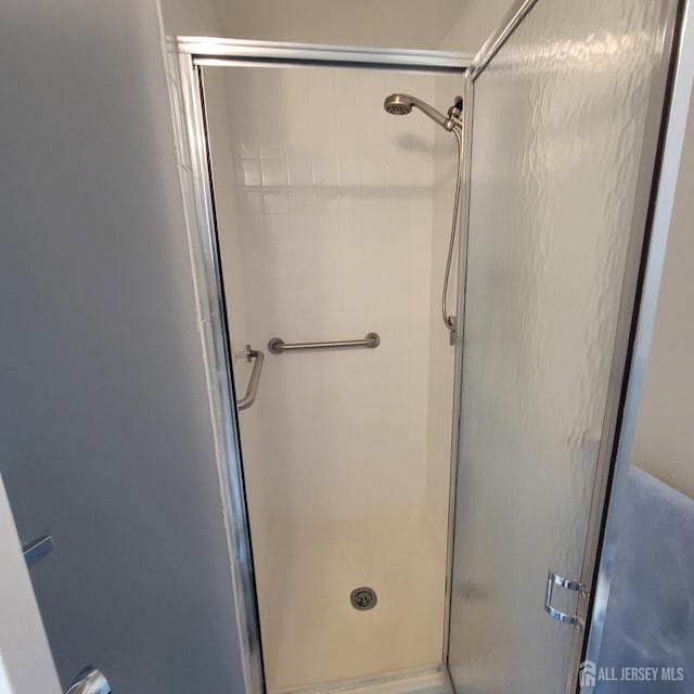 bathroom with a stall shower