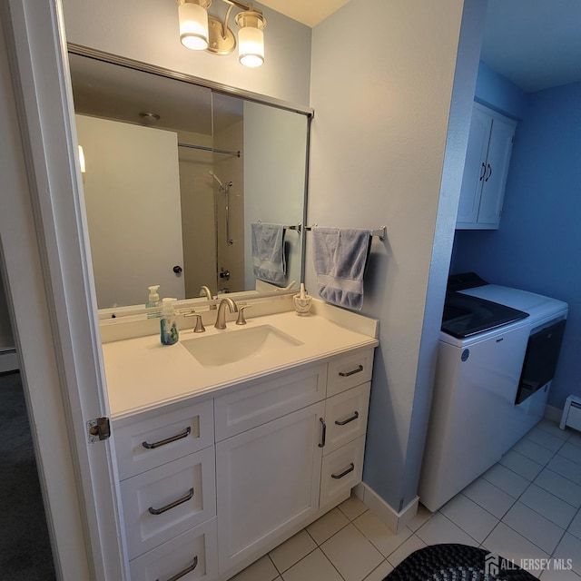 bathroom featuring baseboard heating, vanity, walk in shower, and tile patterned floors