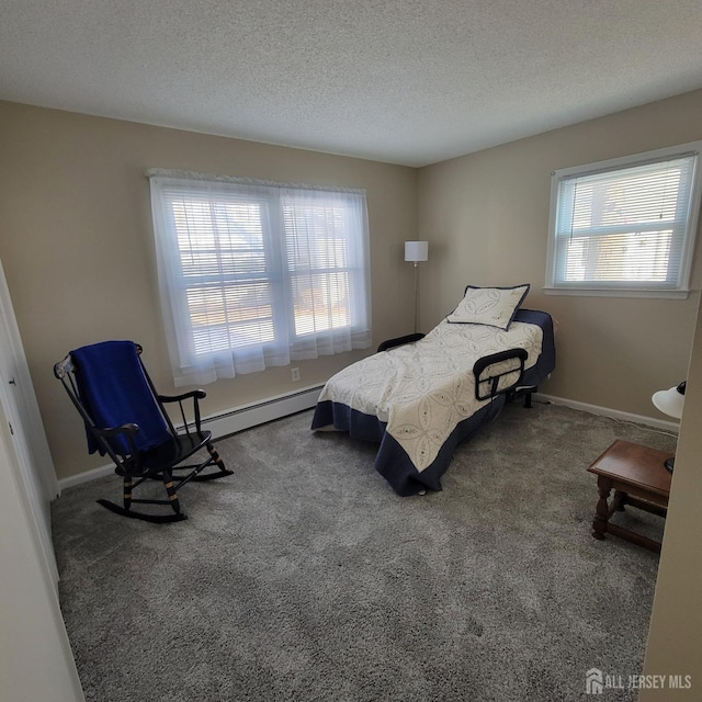 bedroom with a textured ceiling, baseboard heating, multiple windows, and carpet floors