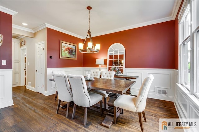 12 Wharton Ct, South Brunswick, NJ 08824 - dining area featuring a chandelier, a wainscoted wall, ornamental molding, a decorative wall, and dark wood-style floors