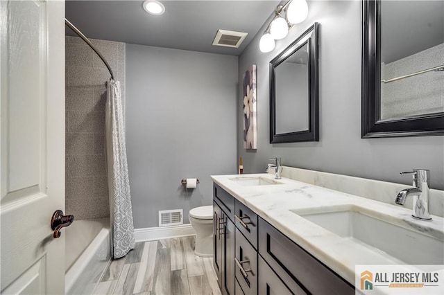 12 Wharton Ct, South Brunswick, NJ 08824 - bathroom featuring shower / bath combo with shower curtain, double vanity, wood finished floors, and recessed lighting