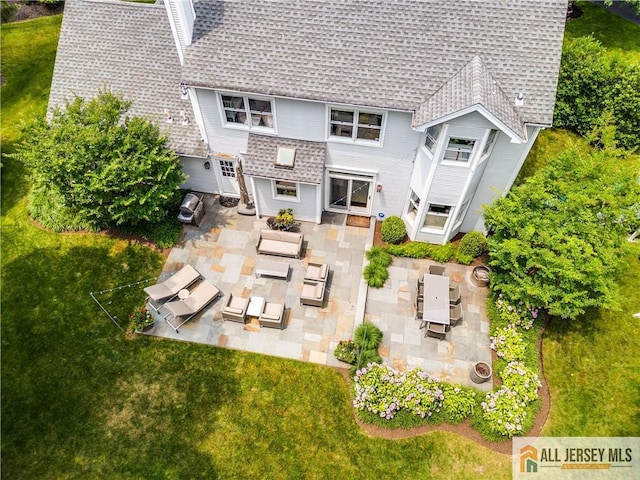 12 Wharton Ct, South Brunswick, NJ 08824 - back of house with a shingled roof, an outdoor living space, a patio, an outdoor kitchen, and a yard