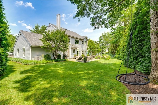 12 Wharton Ct, South Brunswick, NJ 08824 - view of grassy yard featuring a patio and an outdoor living space
