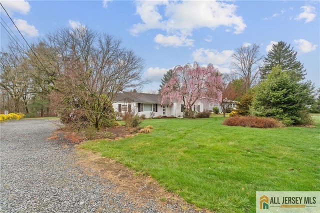 377 Ridge Rd, South Brunswick, NJ 08810 - view of front of house featuring driveway and a front lawn