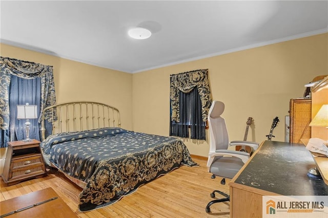 377 Ridge Rd, South Brunswick, NJ 08810 - bedroom featuring wood finished floors, crown molding, and baseboards