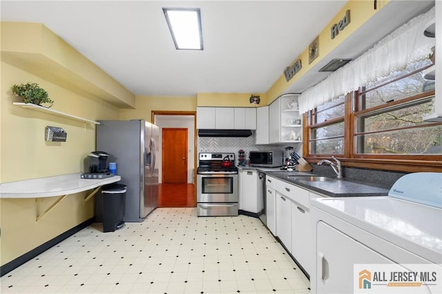377 Ridge Rd, South Brunswick, NJ 08810 - kitchen featuring appliances with stainless steel finishes, open shelves, light floors, and white cabinets