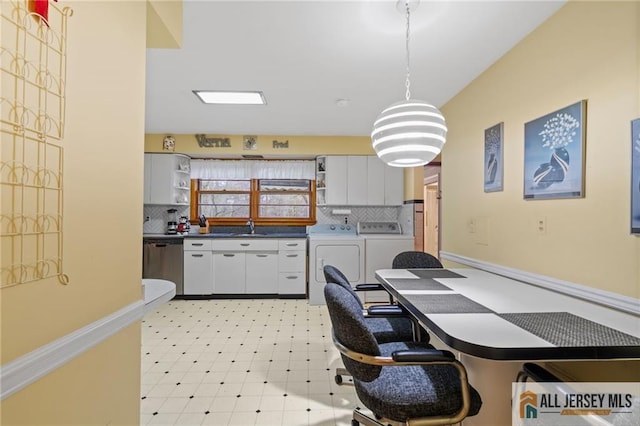 377 Ridge Rd, South Brunswick, NJ 08810 - kitchen featuring open shelves, washer and dryer, dishwasher, a sink, and decorative backsplash