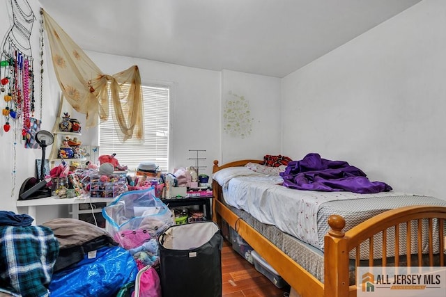 bedroom with wood finished floors