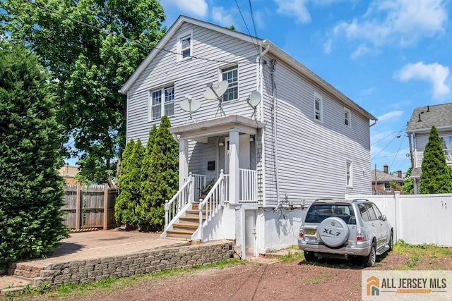 view of front of home with fence