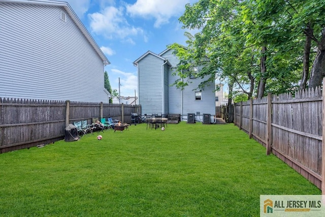 view of yard with central AC