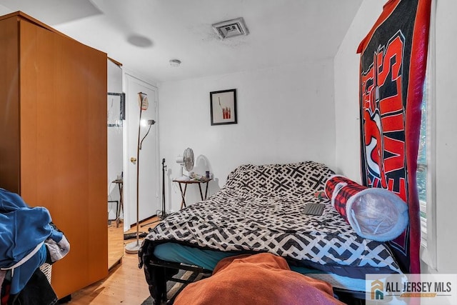 bedroom featuring wood finished floors