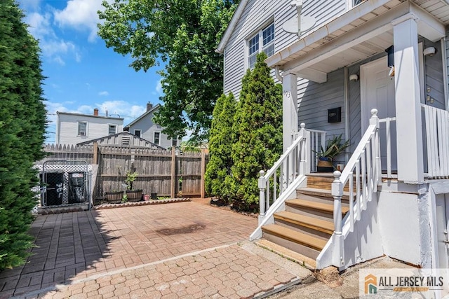 view of patio featuring fence