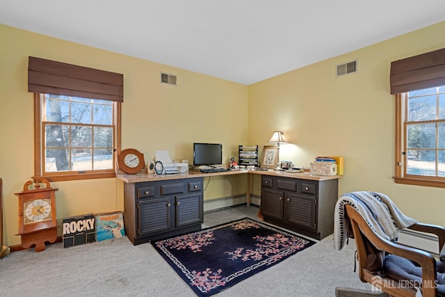 carpeted home office featuring a baseboard radiator and visible vents