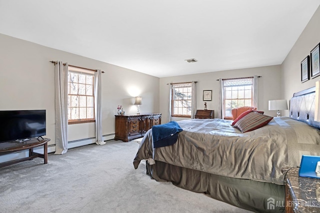 bedroom with visible vents and light colored carpet