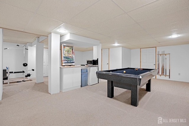 game room featuring carpet floors, pool table, and a paneled ceiling