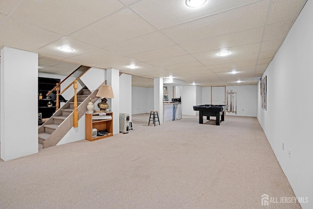 rec room with carpet floors, a drop ceiling, and pool table