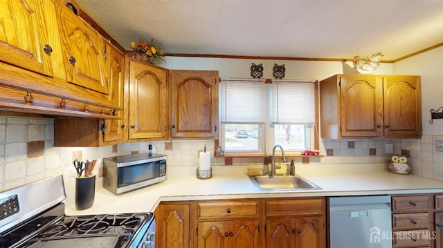 68 Applegate Ave, Monroe, NJ 08831 - kitchen featuring appliances with stainless steel finishes, a sink, tasteful backsplash, light countertops, and a textured ceiling