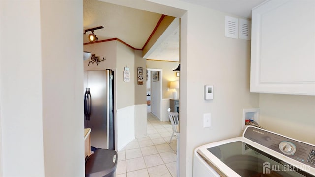 68 Applegate Ave, Monroe, NJ 08831 - clothes washing area with washer / clothes dryer, cabinet space, and light tile patterned floors