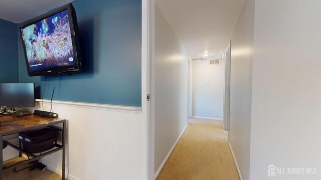 68 Applegate Ave, Monroe, NJ 08831 - hallway with light carpet, a desk, and wainscoting