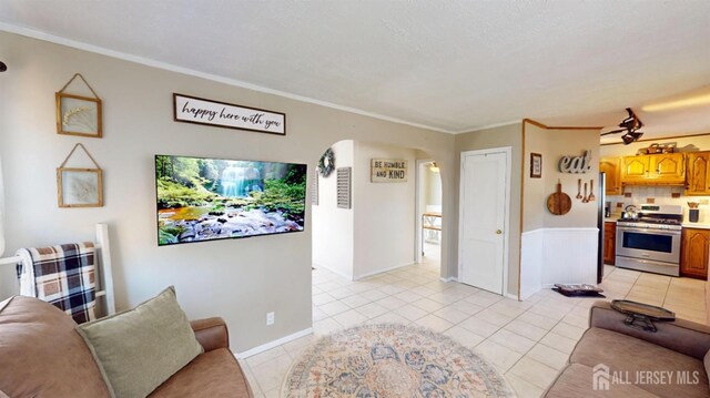 68 Applegate Ave, Monroe, NJ 08831 - living room with light tile patterned flooring, crown molding, and arched walkways
