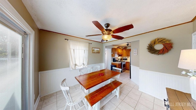 68 Applegate Ave, Monroe, NJ 08831 - dining area featuring wainscoting, ceiling fan, light tile patterned floors, a textured ceiling, and ornamental molding