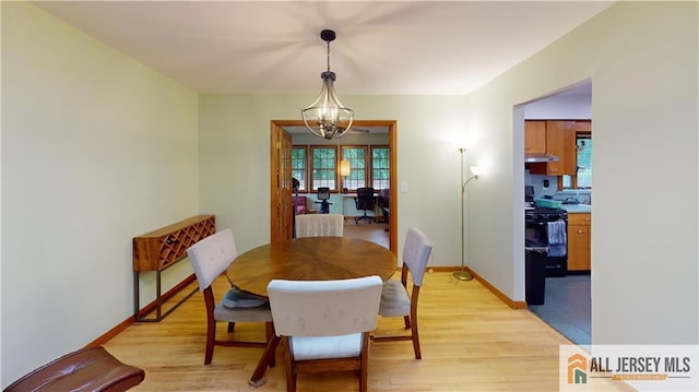 398 Waltham Ave, Metuchen, NJ 08840 - dining area with light wood finished floors and a chandelier