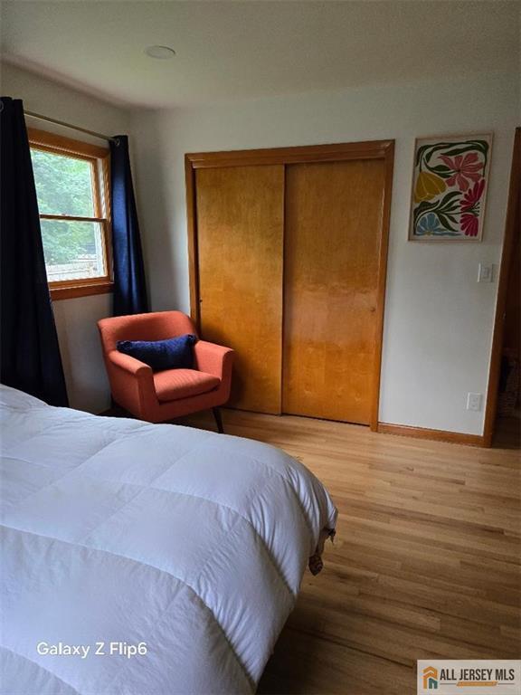 398 Waltham Ave, Metuchen, NJ 08840 - bedroom featuring wood finished floors and a closet