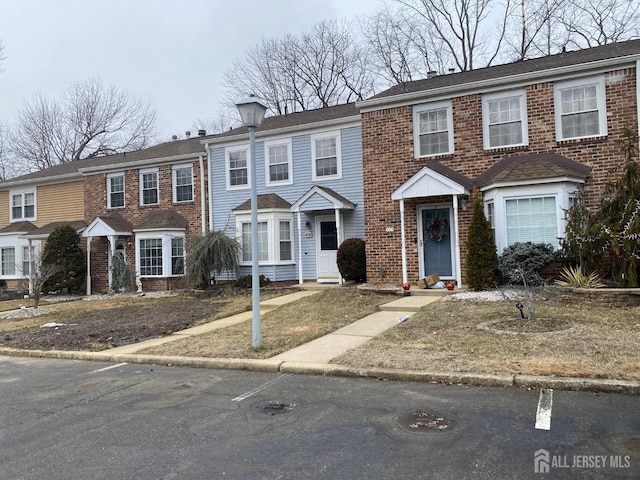 multi unit property featuring brick siding