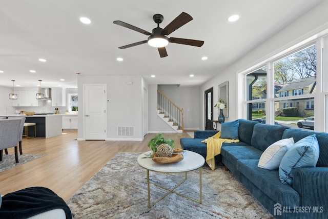 39 S Pierson Rd, Maplewood, NJ 07040 - living room featuring stairs, recessed lighting, ceiling fan, and light wood finished floors