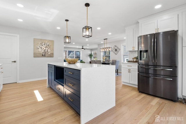39 S Pierson Rd, Maplewood, NJ 07040 - kitchen featuring stainless steel refrigerator with ice dispenser, white cabinetry, light wood-style flooring, pendant lighting, and recessed lighting