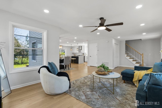 39 S Pierson Rd, Maplewood, NJ 07040 - living room with light wood-style flooring, baseboards, recessed lighting, stairway, and a ceiling fan