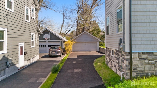 39 S Pierson Rd, Maplewood, NJ 07040 - view of side of home featuring a garage and an outdoor structure