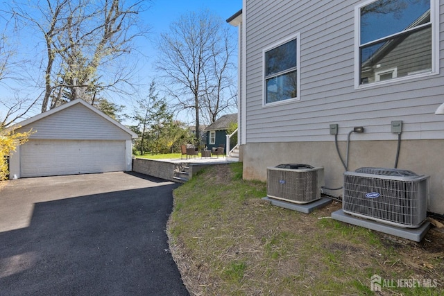 39 S Pierson Rd, Maplewood, NJ 07040 - view of side of property featuring central AC unit, an outdoor structure, and a detached garage