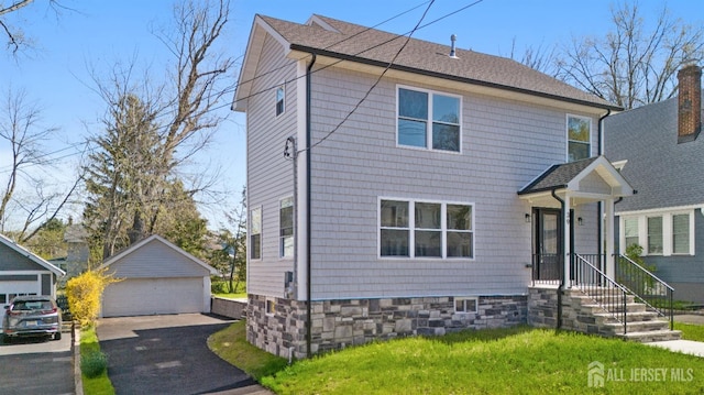 39 S Pierson Rd, Maplewood, NJ 07040 - traditional style home with a garage, an outdoor structure, roof with shingles, and a front yard
