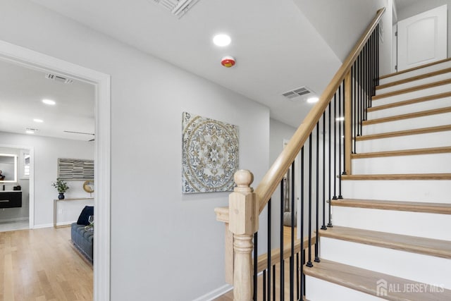 39 S Pierson Rd, Maplewood, NJ 07040 - stairway with wood finished floors, recessed lighting, and baseboards