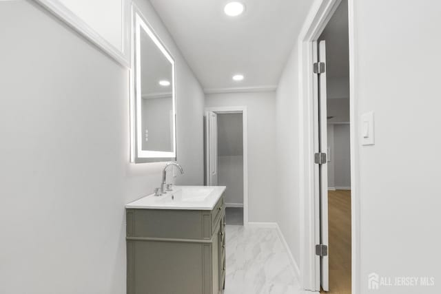 39 S Pierson Rd, Maplewood, NJ 07040 - bathroom featuring recessed lighting, vanity, marble look tiles, and baseboards