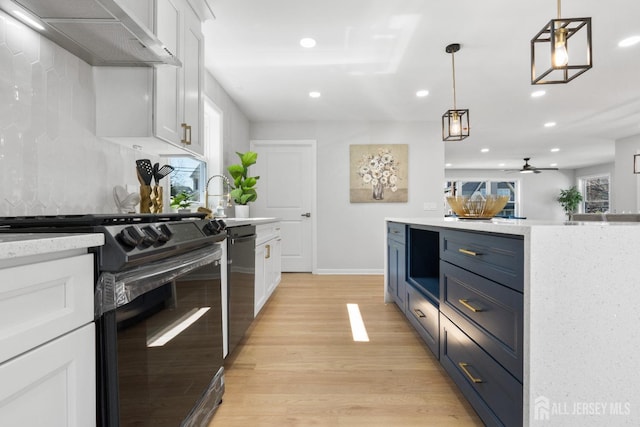 39 S Pierson Rd, Maplewood, NJ 07040 - kitchen featuring black range oven, wall chimney exhaust hood, white cabinetry, stainless steel dishwasher, and light wood-type flooring
