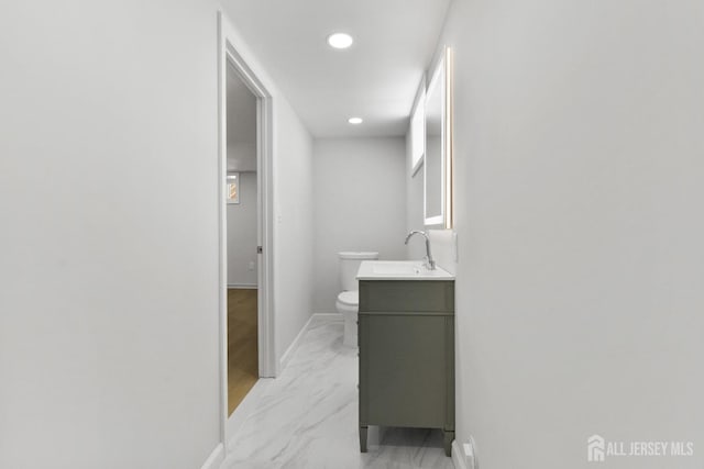 39 S Pierson Rd, Maplewood, NJ 07040 - bathroom with toilet, vanity, baseboards, recessed lighting, and marble look tile flooring