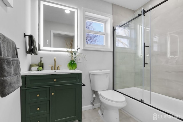 39 S Pierson Rd, Maplewood, NJ 07040 - bathroom featuring toilet, vanity, combined bath / shower with glass door, and baseboards