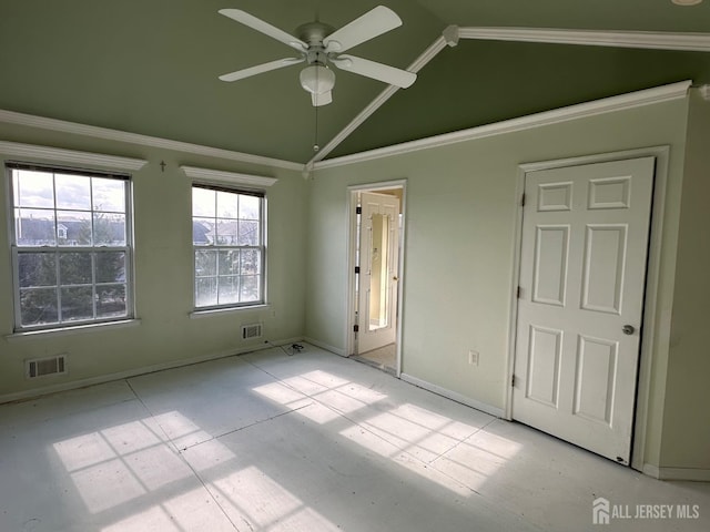 unfurnished bedroom with ornamental molding and lofted ceiling