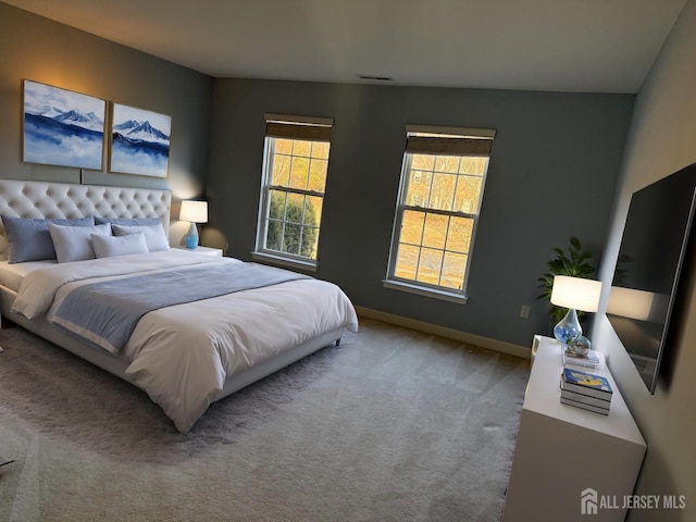 bedroom with visible vents, baseboards, and carpet floors