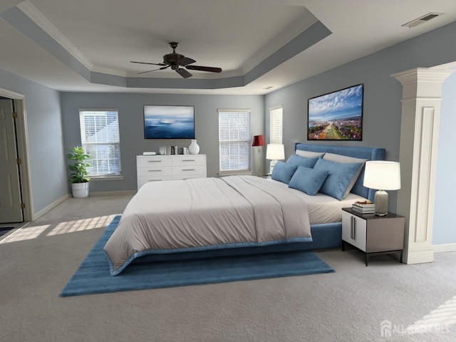 bedroom featuring visible vents, crown molding, carpet floors, a raised ceiling, and ornate columns