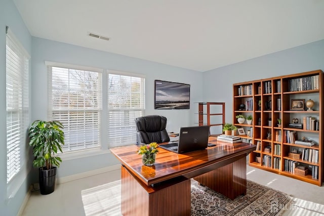 office area with baseboards and visible vents