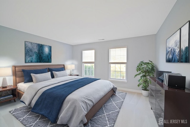 bedroom with baseboards and carpet floors