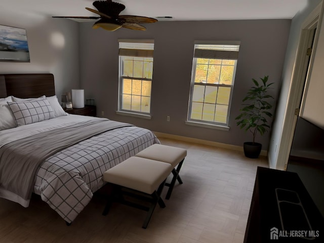 bedroom featuring visible vents, ceiling fan, and baseboards