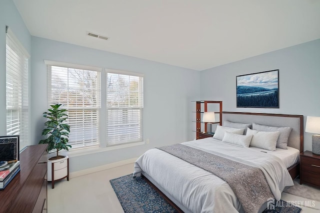 bedroom with visible vents and baseboards